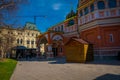 MOSCOW, RUSSIA- APRIL, 24, 2018: Outdoor view of unidentified people walking close to St. Basil`s Cathedral and Royalty Free Stock Photo