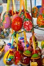 Moscow, Russia - April 12, 2023. Painted wooden eggs on a ribbon for Easter