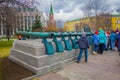 MOSCOW, RUSSIA- APRIL, 24, 2018: People walking close to old military trunks of ancient cannons. Collection incorporates