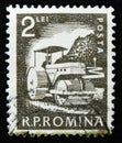 Romania stamp shows lays asphalt compactor, circa 1960