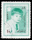 Postage stamp printed in Iran shows Crown prince Cyrus Reza, Children`s day: 4th birthday of the Crown Prince serie, circa 1964