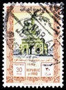 Postage stamp printed in Iraq shows General Kassem, arch of triumph, Army Day serie, circa 1961