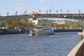 Moscow, Russia - April 29, 2019: River pleasure boat on the Moscow River and Patriarchal pedestrian bridge Royalty Free Stock Photo