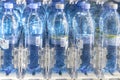 Moscow, RUSSIA - April 12, 2019: rows of water bottles of the Aqua Minerale trademark. Plastic bottle holders in vending machine