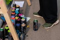 Set of used spray paint cans at summer graffiti festival Royalty Free Stock Photo