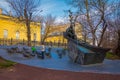 MOSCOW, RUSSIA- APRIL, 29, 2018: Unidentified man with his boy playing close to the Monument to writer Mikhail Sholokhov