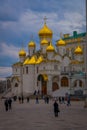 MOSCOW, RUSSIA- APRIL, 24, 2018: Unidentified people in front of golden Annunciation Cathedral or Cathedral of the