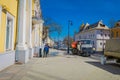 MOSCOW, RUSSIA- APRIL, 24, 2018: View of man driving a cleaning machine washing the pavement with water after event in