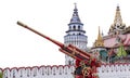 MOSCOW, RUSSIA - AUG 20, 2022: Artillery cannon painted in the old Russian style Khokhloma against the background of the ancient