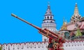 MOSCOW, RUSSIA - AUG 20, 2022: Artillery cannon painted in the old Russian style Khokhloma against the background of the ancient