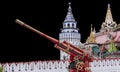 MOSCOW, RUSSIA - AUG 20, 2022: Artillery cannon painted in the old Russian style Khokhloma against the background of the ancient