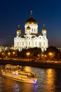 Night view of Moscow Christ the Savior Cathedral, Moskva river with pleasure boat and embankment from Bolshoy Kamenny Bridge Royalty Free Stock Photo
