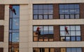 Moscow, Russia, August 31, 2021:  Artplay Design Center is creative technopark. Hand washers climbers for exterior windows of high Royalty Free Stock Photo