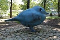 Sculpture of a blue bird in the park