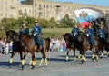 The cavalry honorary escort of the Presidential Regiment speaks against the background of the monument to the heroes of the First