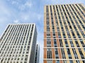 ÃÂ¡lose up of new multi-storey apartment block houses. Mortgage concept. Tall as skyscrapers. Blue sky Royalty Free Stock Photo