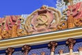 Moscow, Russia - August 01, 2018: Coat of arms of Ukrainian SSR against blue sky on facade of pavilion on VDNH in Moscow on a sunn