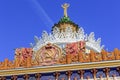 Moscow, Russia - August 01, 2018: Coat of arms of Ukrainian SSR against gilded spire with soviet star on facade of pavilion on VDN