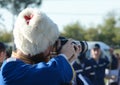 The Cossack photographer shoots at the event. Royalty Free Stock Photo