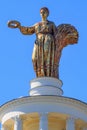 Moscow, Russia - August 01, 2018: Figure of woman of collective farmer closeup against blue sky on a roof of pavilion Republic Of Royalty Free Stock Photo