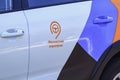 Moscow, Russia - August 01, 2018: Fragment of car door with logo Moscow Carsharing closeup