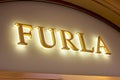 MOSCOW, RUSSIA - AUGUST 10, 2021: Furla brand retail shop logo signboard on the storefront in the shopping mall.