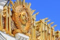 Moscow, Russia - August 01, 2018: Gilded coat of arms of Soviet Union closeup against blue sky on facade of pavilion Central on VD