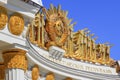 Moscow, Russia - August 01, 2018: Gilded coat of arms of Soviet Union closeup over colonnade of pavilion Central on VDNH in Moscow