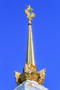 Moscow, Russia - August 01, 2018: Gilded spire with soviet star closeup on the tower of pavilion Central on Exhibition of Achievem