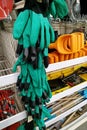 Moscow, Russia - August 17, 2019: Green protective work gloves on the stand in a building materials store Royalty Free Stock Photo