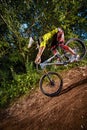 Mountain bike cyclist doing stoppie Ã¢â¬â ridden on the front wheel on a mtb bike.