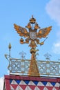 Moscow, Russia - August 06, 2018: Russian coat of arms on the roof of building in Izmailovo Kremlin against blue sky closeup. Cult