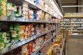 Moscow, Russia - August 23, 2020: Shelf with dairy products of different brands in a large supermarket. Empty shop and showcase