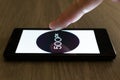 MOSCOW, RUSSIA - August 19, 2018: A smartphone lying on a table in the dark, displaying the logo of the 500px