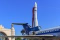 Moscow, Russia - August 01, 2018: Tail with engines and wing of soviet aircraft Yak-42 against Vostok booster rocket on Exhibition