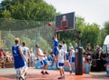 Moscow, Russia - August 4, 2018: Team playing basketball in the Gorky Park in summer. Basketball player throws the ball