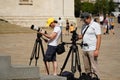 Moscow, Russia - August 28. 2022: Two photographers shoot foto on Red Square in Moscow