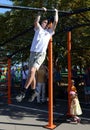 An unknown street athlete performs exercises on Poklonnaya Hill.