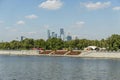 Moscow, Russia - August 10, 2017: View of riverside of Moscow river and Moscow city skyscrapers behind the trees Royalty Free Stock Photo