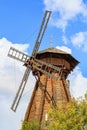 Moscow, Russia - August 06, 2018: Wooden windmill in Izmailovo Kremlin on a blue sky background in sunny summer morning. Cultural