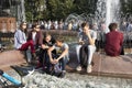 Young people are sitting around the fountain near the cinema Russia on Pushkinskaya Square