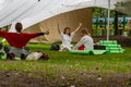 MOSCOW, RUSSIA - AUGUST 02, 2019: Young women yoga practitioners in group doing yoga on nature