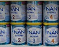 03-08-2019 Moscow, Russia. Baby food milk formula NAN Nestle in large white blue metal cans on a store shelf