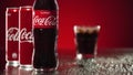 Moscow, Russia - 14 04 2020: Cinematic commercial shot of coca cola pouring in glass with ice cubes and rack focus on Royalty Free Stock Photo