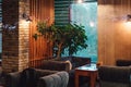 Moscow. Russia. Circa 2022. New designer cafe in loft style. Night photos of the institution. Natural wood tables and