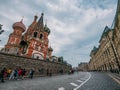 Moscow, Russia - Circa September 2018 : Red Square near Kremlin, St. Basil Cathedral and tourists on street in Moscow Royalty Free Stock Photo