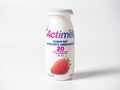 20.10.2021 , Moscow, Russia. Close-up of actimel drinking yogurt with strawberry flavor in a plastic bottle on a white background