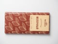 20.10.2021 , Moscow, Russia. Close-up of a vkusvill milk chocolate bar on a white background. A Russian product. Top view, flat