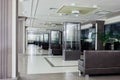 Interior of spacious lobby with leather sofas and