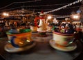 Moscow, Russia, december, 2015. Attraction cups of tea spinning in a circle.